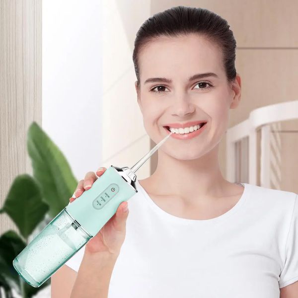 Портативний іригатор для порожнини рота 230 мл, Portable Oral Irrigator, Блакитний / Електричний іригатор для зубів з насадкой 234563499 фото